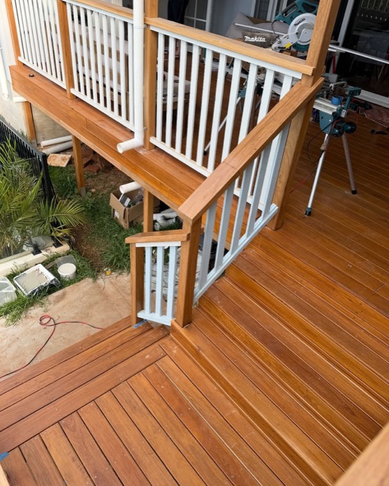 A timber staircase and balustrade part-built on site
