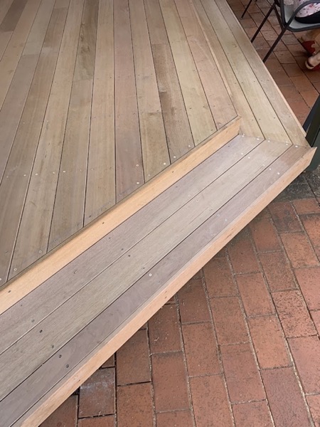 Hardwood deck boards running to a squared edge
