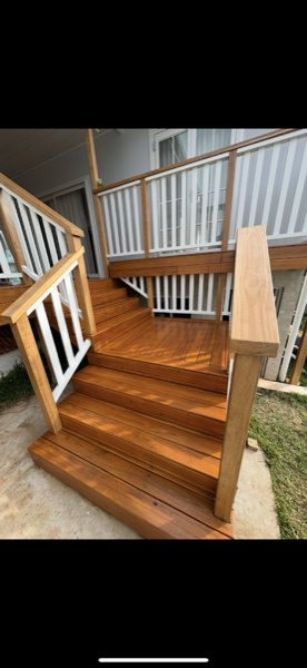Timber stair treads beside a white balustrade