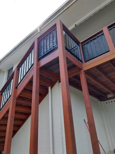 External timber stairs with a metal balustrade