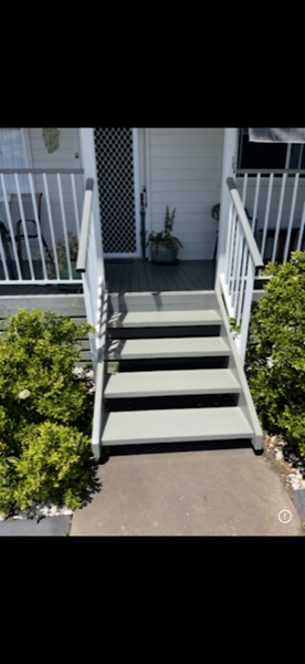 External stairs with a painted timber balustrade