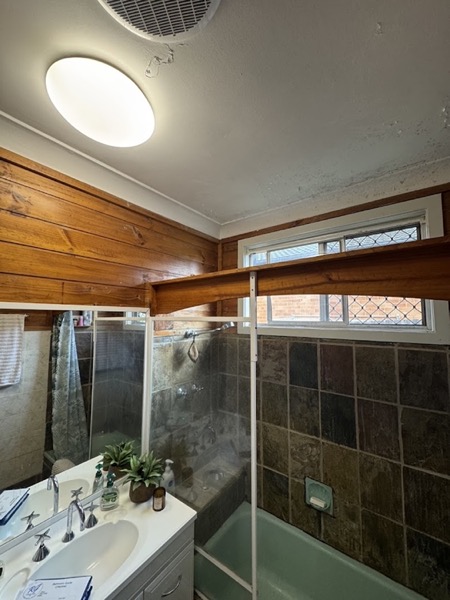 A timber lined ceiling and eave above a bathroom window